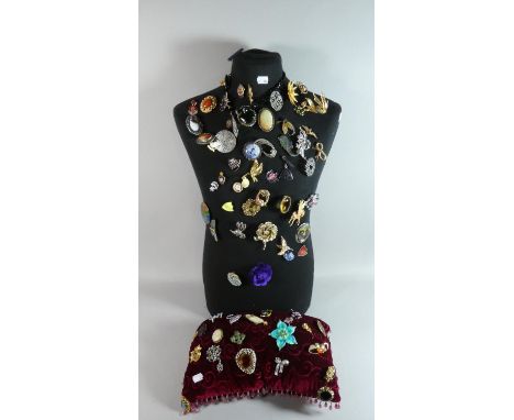 A Tailers Torso Dummy with Large Quantity of Costume Jewellery Brooches Together with a Red Velvet Cushion Also Containing Co