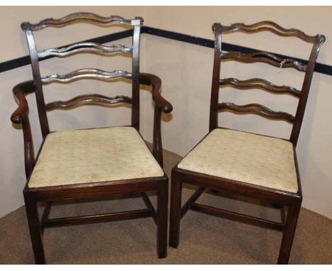 SET OF SIX MAHOGANY LADDER BACK DINING CHAIRS OF CHIPPENDALE DESIGN with upholstered drop in seats, on chamfered legs with st