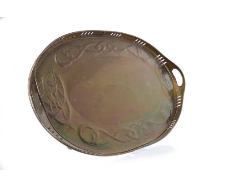 ARTS & CRAFTS EMBOSSED BRASS TRAYwith twin handles, decorated with bands of Celtic knot designs, 58cm long 