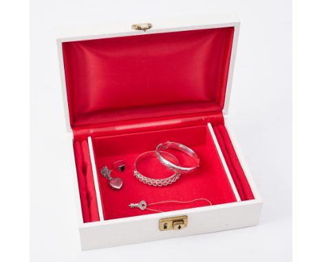 A mixed lot of silver jewellery to include two silver bangles, a silver locket, silver chain &amp; silver ring, total weight 