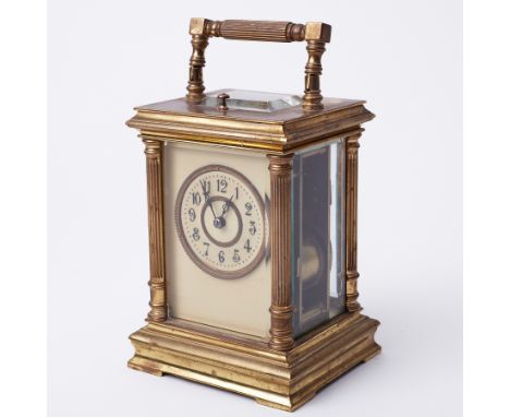 A French carriage clock with platform escapement, striking on a gong with repeater movement, height handle up 20cm.