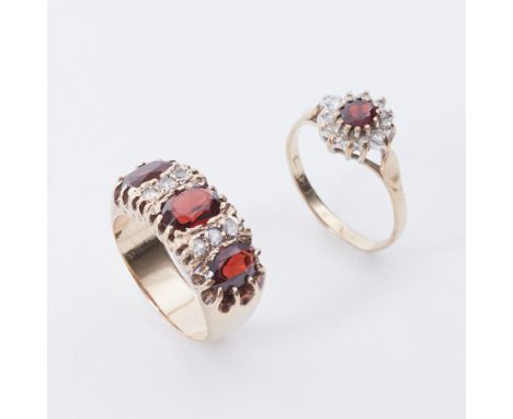 Two rings to include a 9ct yellow gold cluster ring set with an oval cut garnet and surrounded by small round cut diamonds, 1