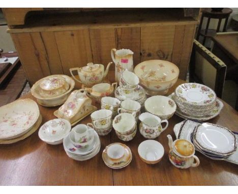 A collection of Devon ware lune to include a teapot on a stand and a fruit bowl, together with a Salisbury China Bradley part