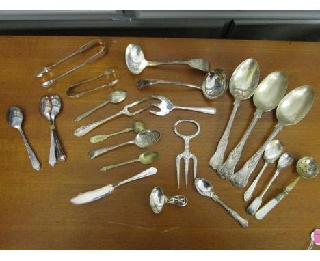 A quantity of silver and silver plate flatware to include a silver tea caddy spoon 