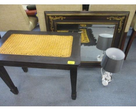 A padouk and cane stool with spaded feet, together with an inlaid mirror, a modern Oriental vase and a modern lamp 