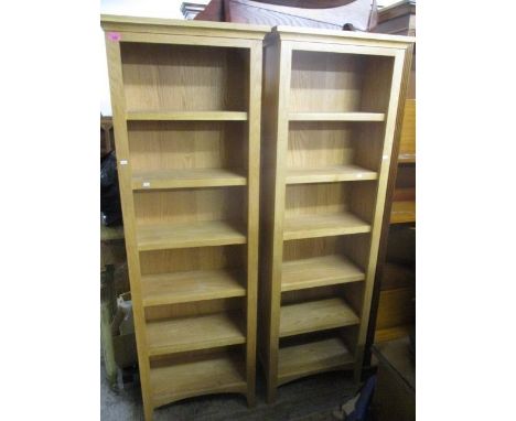 A pair of modern light oak, six tier bookcase, 71" h x 23 1/2"w 