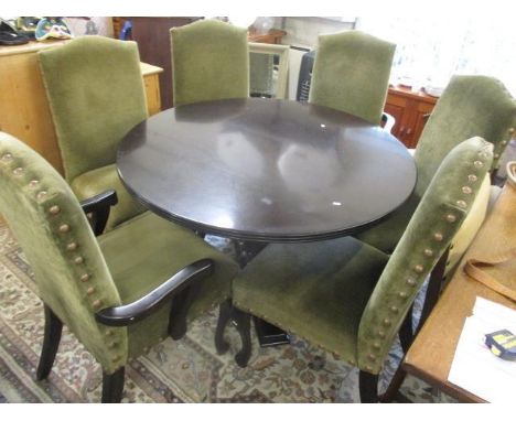A modern circular topped dining table, 30" h x 47" w, together with six button back dining chairs 