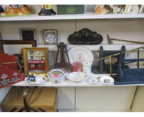 A silver plated, framed table clock, mixed household items to include a letter rack, painted treen and a candle snuffer 