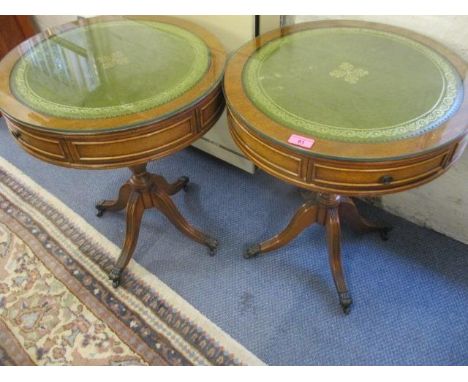 A pair of reproduction lamp table with green leather tops 