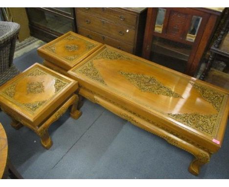 An oriental hardwood carved coffee table, 17"h x 48" w, together with two matching lamp tables, 17"h x 18" w 