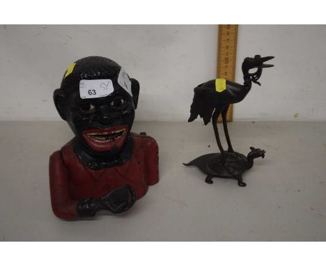 Novelty cast iron moneybox and a small Japanese figure of a crane riding a terrapin Notice from the the-saleroom.com: These i