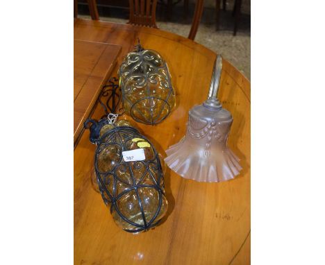 A pair of glass and metal framed ceiling light fittings together with a further desk lamp