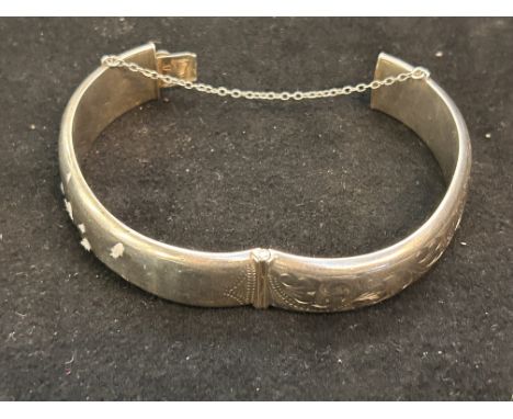 Silver bangle (some bruising) 25 grams with safety chain 
