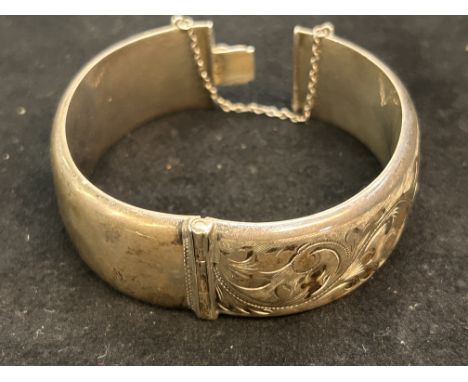 Silver bangle (some bruising) 35 grams with safety chain 