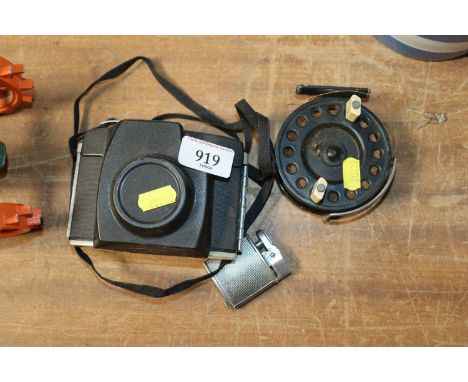 A vintage fishing reel, a lighter and a Kodak camera 