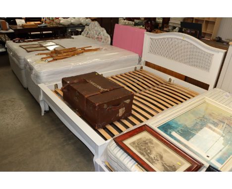 A modern double bedstead with cane backed bedhead (no mattresses) 