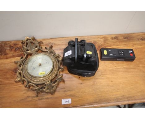 A gilt framed barometer AF; a pair of Prinz 8 x 30 binoculars in case and a Taurus camera