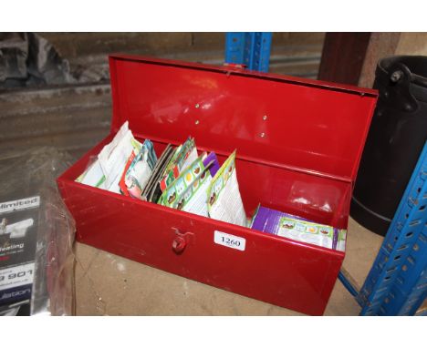 A red metal tool box and contents of various seeds to include tomatoes, swede, runner beans etc.