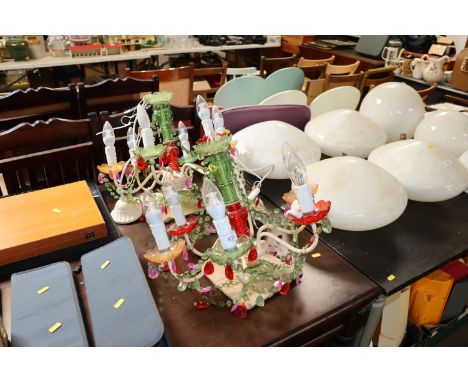 A pair of coloured six light chandeliers with drops 
