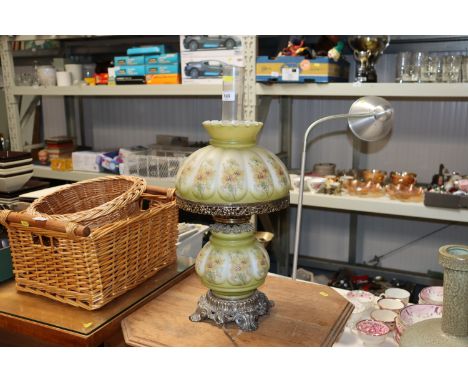 An opaque table lamp in the style of a Victorian oil lamp