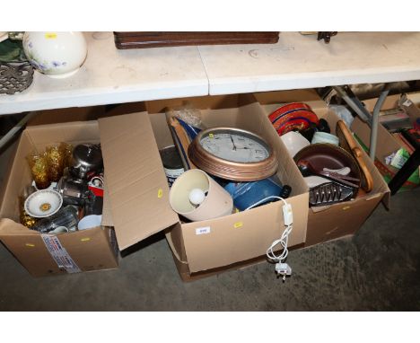 Three boxes of miscellaneous kitchenalia, a wall clock, table lamp etc.