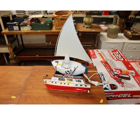 A lamp in the form of a boat and a model boat
