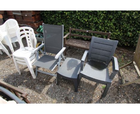 A pair of plastic chairs and matching table, folding light weight garden chair and three plastic white garden chairs
