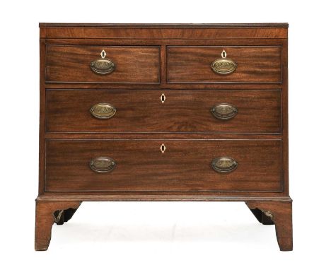 A George III Mahogany and Boxwod-Strung Straight Front Chest, early 19th century, the moulded top above two short and two lon