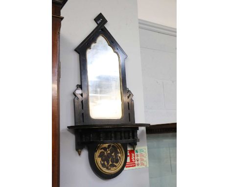 An Aesthetic Period Mirror, ebonised and parcel gilt, with shelf, 36cm by 80cm