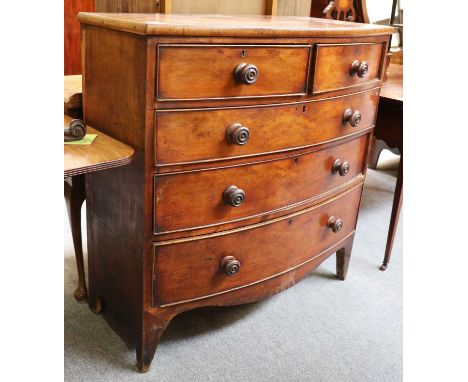 A George III Mahogany and Oak-Lined Bowfront Chest, early 19th century, of two short over three long graduated drawers with o