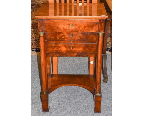 A Regency Mahogany Work Table, the rectangular hinged top opening to reveal a mirror and compartments over a dummy drawer abo