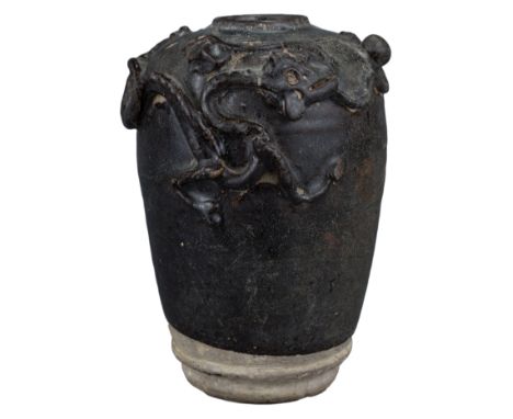 A Chinese Song Dynasty Stoneware Jar with Dragon Chasing Pearl. Heavily-potted and coated in a dark brown glaze. Further deco