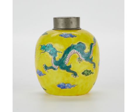Chinese porcelain lidded jar, glazed with a scene of a green flying dragon chasing a flaming pearl over a yellow ground. Mark