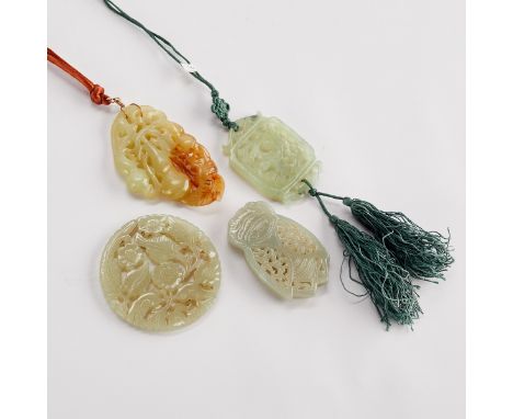 Group of four modern Chinese jade and serpentine carvings. Several with finely pierced decoration and one in the form of a ci