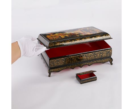 Group of two Russian hand-painted lacquer boxes with red interiors. The large box with a scene of a royal processional arrivi