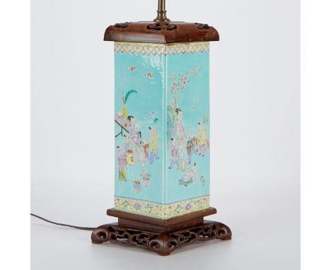 Chinese famille rose porcelain lamp painted throughout with scenes of home life against a vibrant turquoise ground. Of a rect