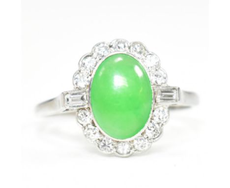 An Art Deco 18ct gold and platinum translucent jade and diamond ring with certificate. The 18ct white gold and platinum Art D
