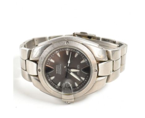 A Seiko perpetual calendar titanium wristwatch. With spare link. Measures 11cm. Weight 80.38g.  All weights, measurements and