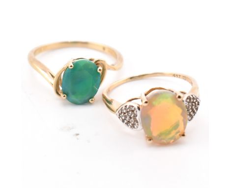 Two hallmarked 9ct gold and opal rings. The rings to include a hallmarked 9ct gold Ethiopian and diamond ring, hallmarked for