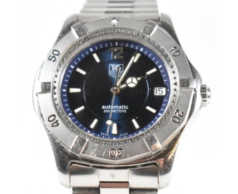 A Tag Heuer Automatic stainless steel wristwatch. The blue dial with baton and qtr number markers, date aperture at the three
