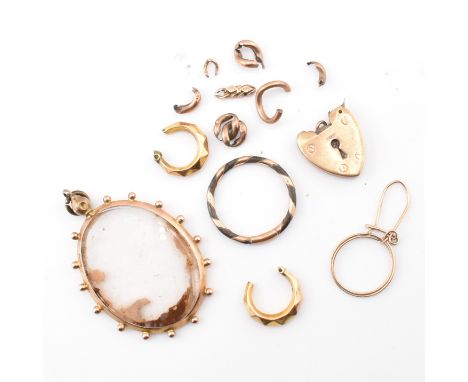 An assortment of gold jewellery fragments AF. The lot to include a 9ct gold heart padlock clasp AF, marked 9ct to verso. A ha