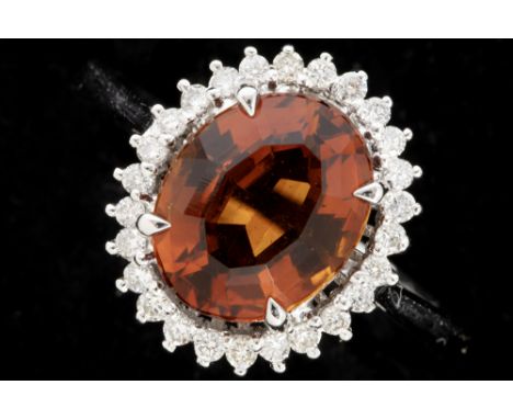 ring in white gold (18 carat) with an oval, at least 2,50 carat Citrine with a quite special color, surrounded by at least ha