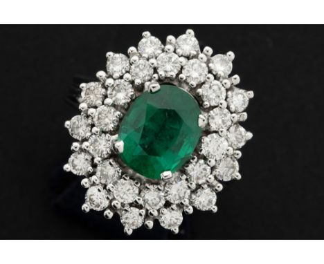 classy ring in white gold (18 carat) with a 2,20 carat Zambian emerald surrounded by ca 2,20 carat of high quality brilliant 