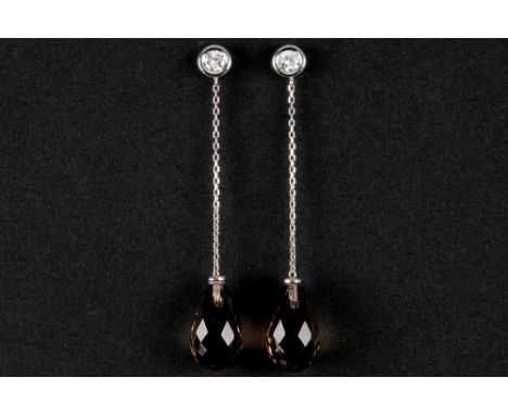 pair of quite long earrings in white gold (18 carat) with smokey topaz in briolette cut and 0,30 carat of very high quality b