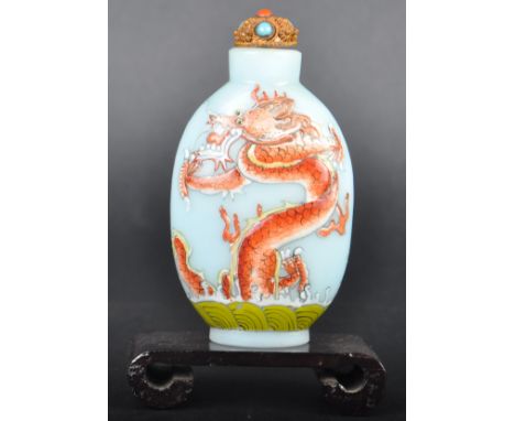 An early 20th Century Chinese Republic Period Oriental Peking glass snuff bottle having hand painted enamel decoration depict
