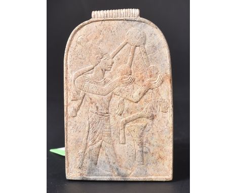 An Egyptian pottery amulet / amuletic tile. Depiction to front depicting deity holding orbs with arched top and fixing loupe 