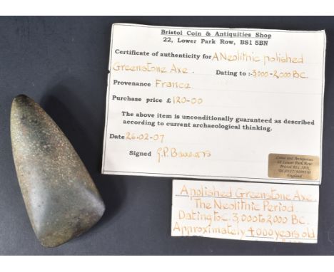 A 2000-3000 BC Neolithic polished greenstone axe head from France. Typical form with polished grip and bladed end. Measures a