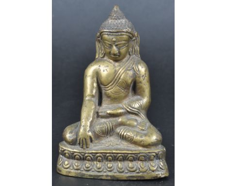 A 19th Century Indian bronze figurine depicting a Buddha. Chinese / Buddhist influence with beaded headdress and medallions d