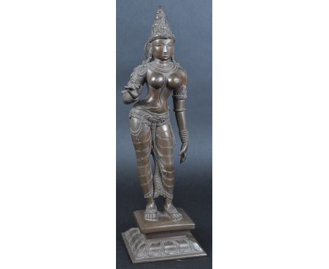 A 19th Century Southern Indian Hindu large standing bronze figurine depicting Parvati . The figure modelled standing with cro