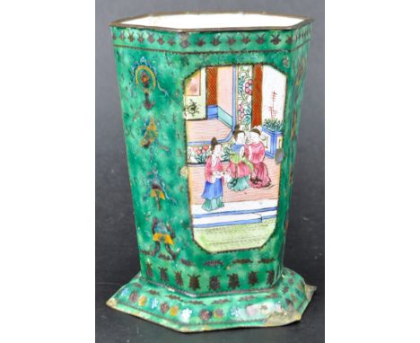An early 20th Century Chinese Qing Dynasty Canton enamel vase. The vase of typical form with white ground &amp; polychrome de